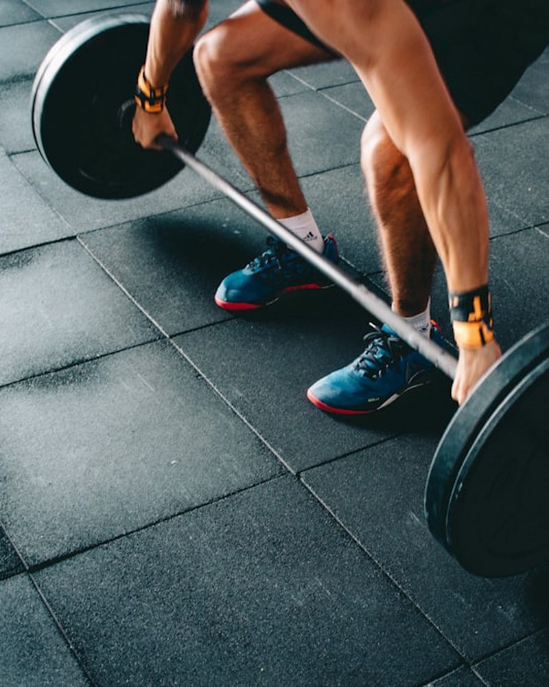 Lifter pulling a loaded barbell
